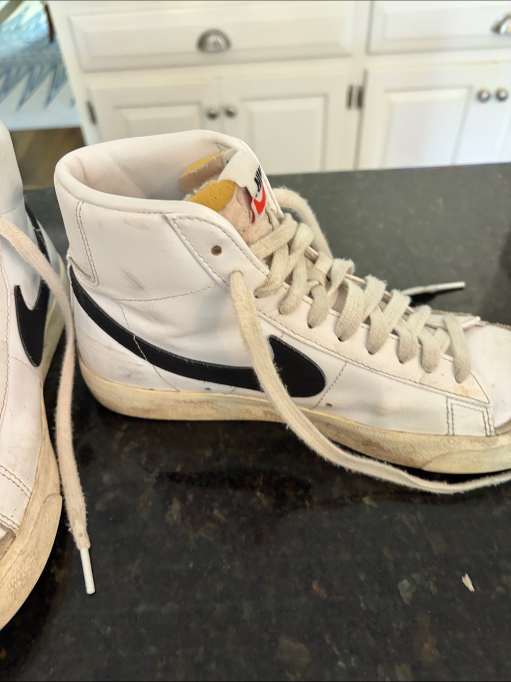 Nike Men’s White High-Top Sneakers with Black Swoosh